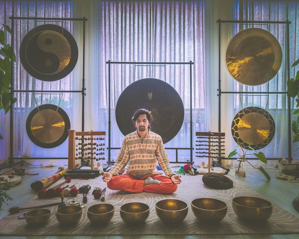 Grand Master Akash Banjara among singing bowls and gongs