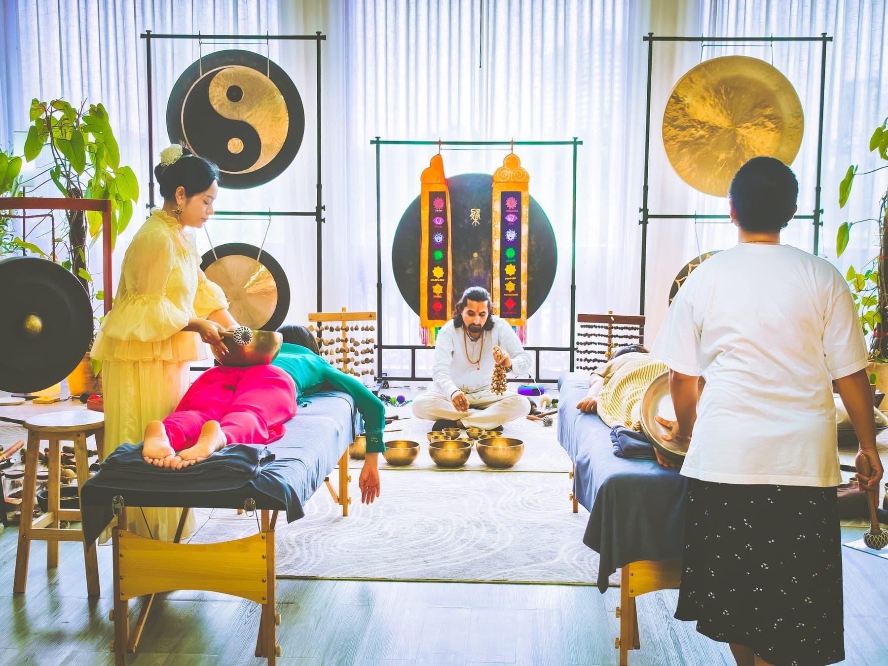 A group sound healing session with gongs and singing bowls